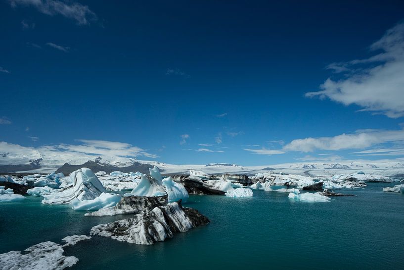 Iceland - Glacier behind giant icebergs on glacial lake, aerial photograph by adventure-photos