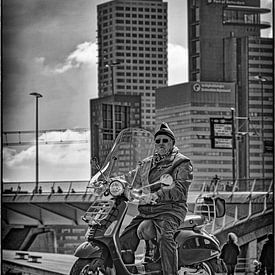 Man on scooter in the big city by Pierre Verhoeven