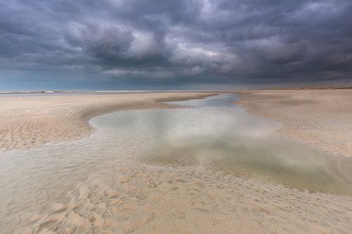 Rain clouds over the North Sea beach Terschelling.