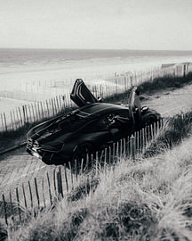 Monochrome Solitude: Black Lamborghini Revuelto by the Sea by Mohit Hambiria