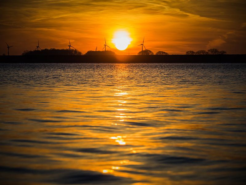 Sunrise at water by Martijn Tilroe