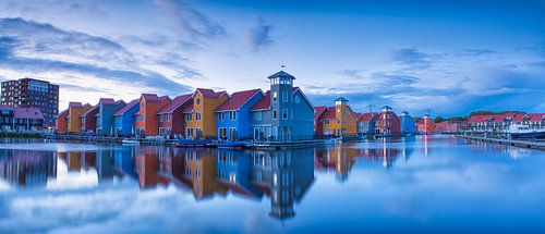 The colored houses of Reitdiephaven in the City of Groningen during a beautiful, calm sunset.
