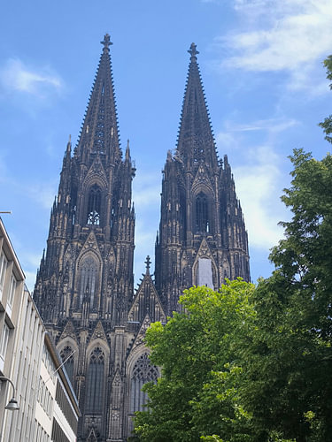 The majestic Cologne Cathedral against a blue sky
