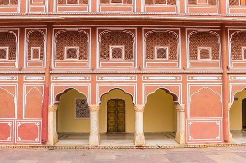 Colorful facade of the Chandra Mahal building of the city palace in Jaipur
