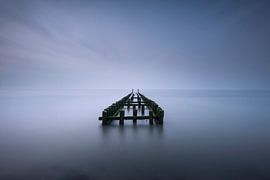 Breakwaters in the fog on the Zeeland coast by Jolanda de Leeuw