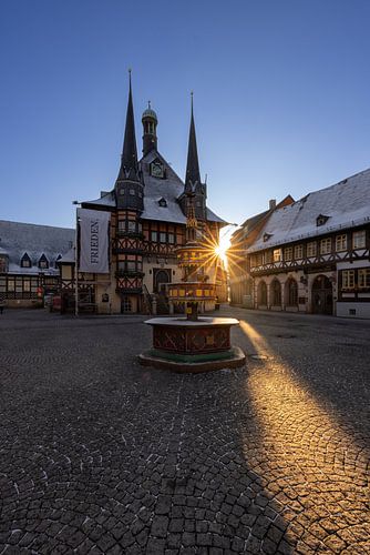 Wernigerode town hall in the Harz Mountains at sunset with aperture star by Thomas Rieger