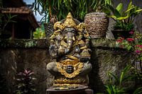 Gold-encrusted stone Ganesha statue in Ubud, Bali, Indonesia.