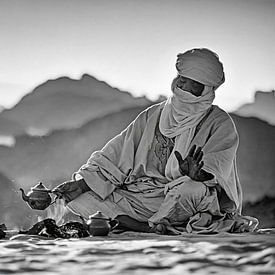 Algeria, near Djanet. Sahara Desert. A man from the Tuareg tribe makes tea. by Frans Lemmens