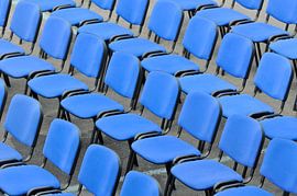 Blue chairs in an arena