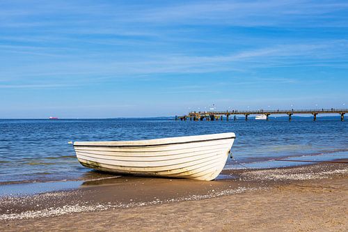Fishing boat and pier on the beach of Bansin on the island of Us by Rico Ködder