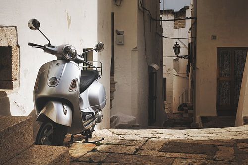Vespa scooter in an alley in Italy