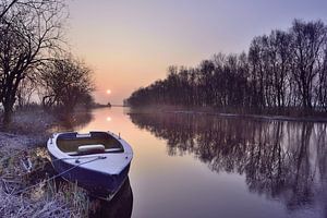 Boat at sunrise by John Leeninga