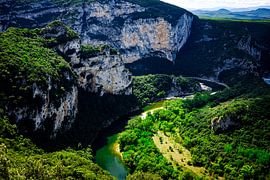 Southern French landscape where the Ardèche river winds between the mountains
