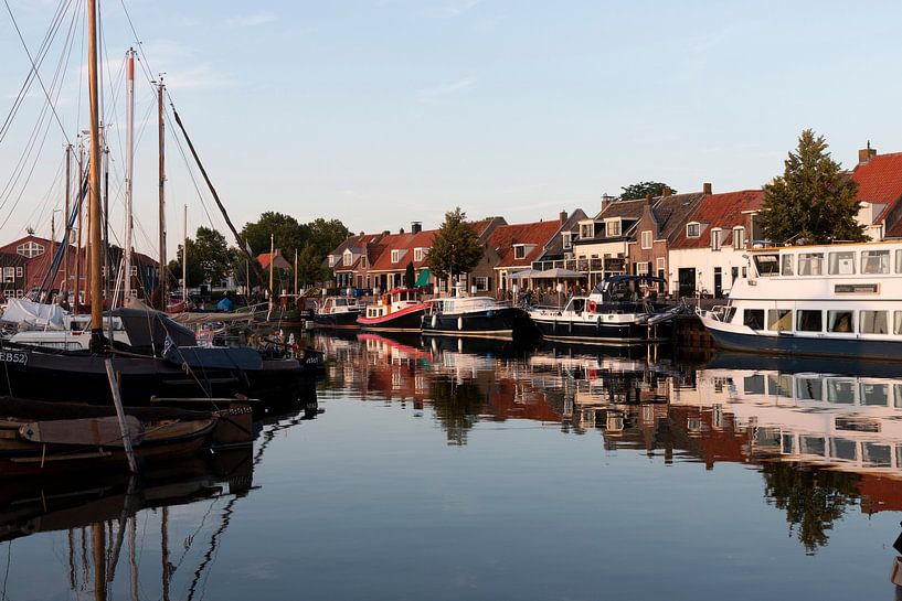 Elburg Marina in the evening with boats and reflections by Marianne van der Zee
