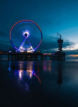 The Ferris wheel on the pier of Scheveningen at sunset by Arthur Scheltes