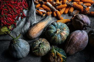 Colourful still life of fresh pumpkins, red chilli peppers and corn by Chi
