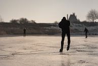 Schaatsers op het ijs van Percy's fotografie thumbnail