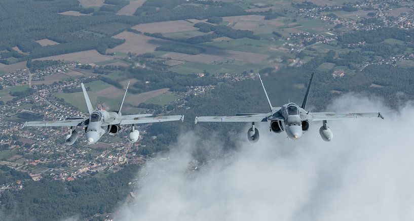 Two Spanish EF-18A Hornets. by Jaap van den Berg