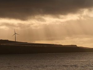 Windmolen bij de ondergaande zon