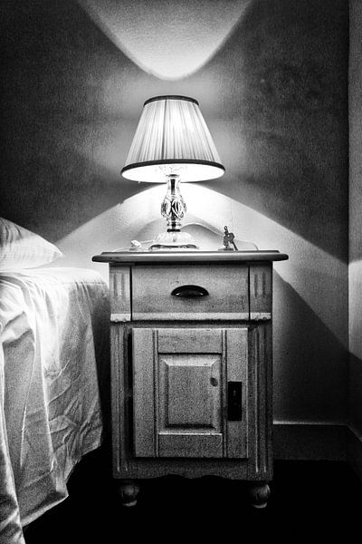 Old lamp on bedside table by Esther Hereijgers