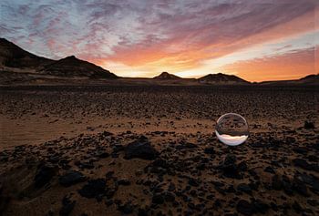 Crystal ball in a lava landscape