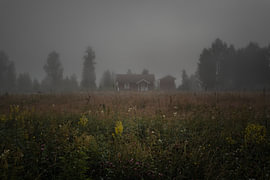 Swedish landscape – Horizontal panorama of a traditional red cottage in the mist by Dylan Winter Visuals