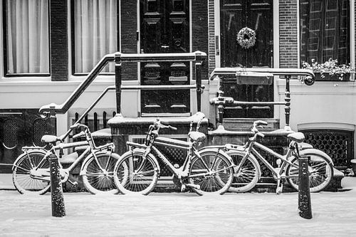 Snow covered bikes in Amsterdam