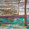 Wooden hull with rust and peeling paint by Frans Blok