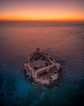 Castle in the sea at sunset in Turkey by Ewold Kooistra