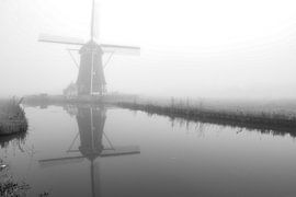 Mill in the mist on the water by vincentdevriesfoto.nl