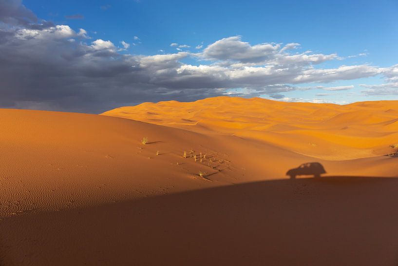 Wide dunes of desert sand with visible footprints of visitors by Tjeerd Kruse