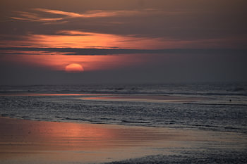 A beautiful, peaceful sunset on Formerum beach by the sea, Terschelling.