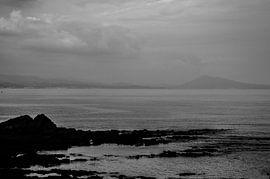 Grey mountain and sea