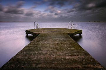 Lake Tjeukemeer jetty with threatening cloud cover