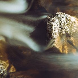 Stone in running water by Yuri Verweij