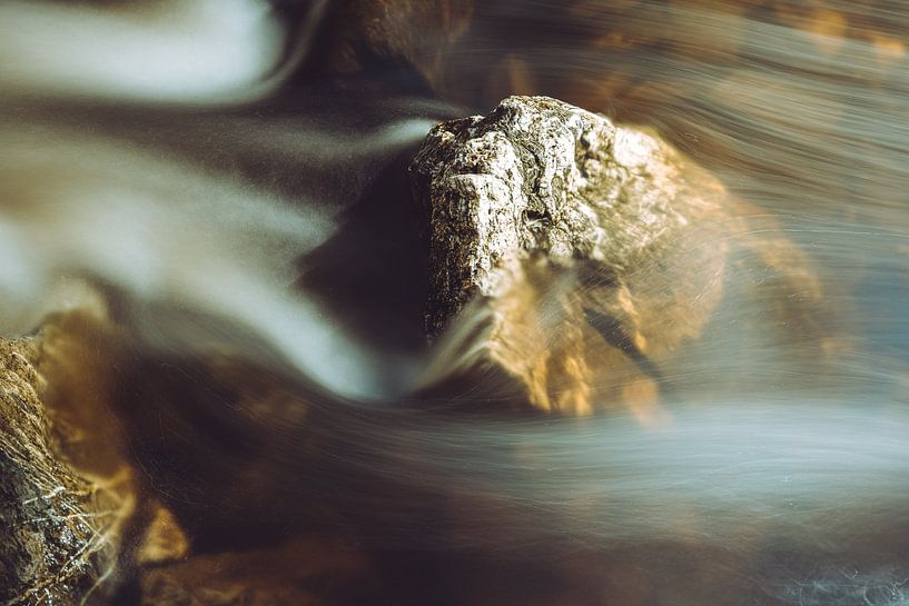 Stone in running water by Yuri Verweij