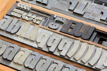 Drawer with letters in a print shop by Heiko Kueverling