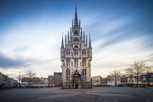 Gouda town hall with flag and sunset