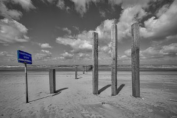 Beach poles at nude beach by Peter Bartelings