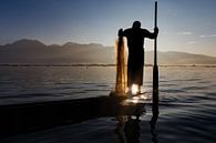 FISHERMAN AT SUNRISE vist ON TRADITIONAL WAY TO INLE LAKE IN MYANMAR. With a basket the fish is caug by Wout Kok thumbnail