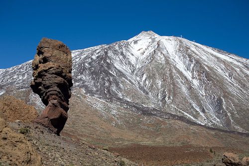 Finger of God in front of the snow-covered Teide