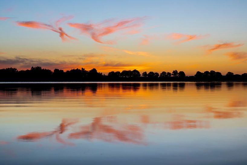 Clouds reflect in water, morning red, high shutter clouds by Karin Broekhuijsen