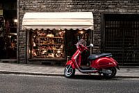 Red scooter in Italian street. 
