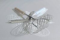 Still life of whisks and masher.