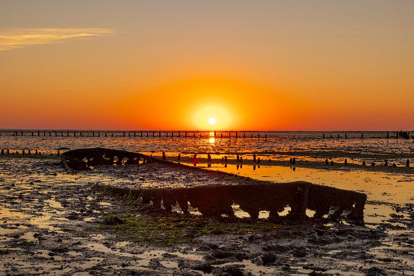 Wadden Sea, sunrise at Paesens Moddergat (Shipwreck of Wierum) by Gert Hilbink