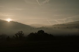Sunrise over misty hills in the Sauerland by LinaTea UmbraVisuals