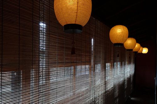 Atmospheric lanterns and bamboo window decorations in a Japanese home