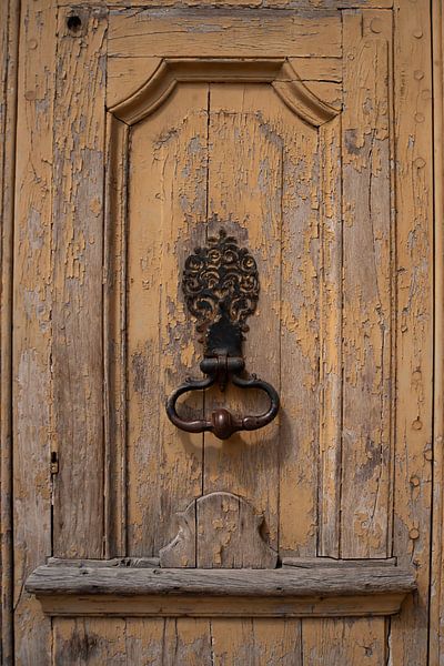 Old wooden door with decorative door knocker in Burgundy (France) by Birgitte Bergman