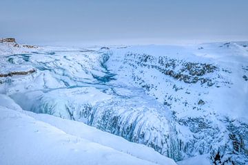 Winter landscape frozen waterfall Iceland by Marjolein van Middelkoop