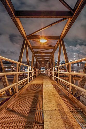 Pedestrian bridge in river Scheldt during twilight, Antwerp
